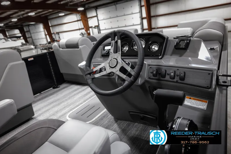 Slide: The Image of 2025 Bennington 21 SL boat interior with modern steering and seating. - 26