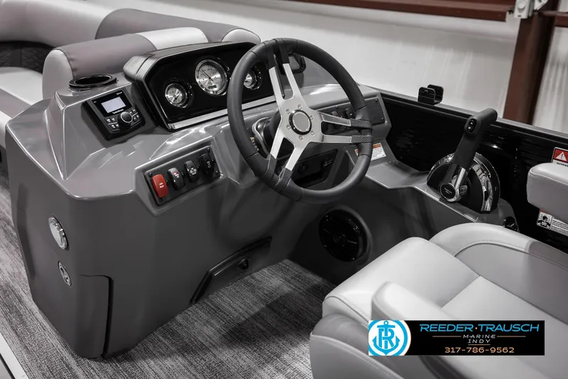 Slide: The Image of 2025 Bennington 21 SL boat dashboard with steering wheel and controls. - 27
