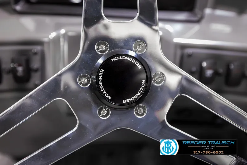 Slide: The Image of Close-up of 2025 Bennington 21 SL steering wheel with logo. - 28