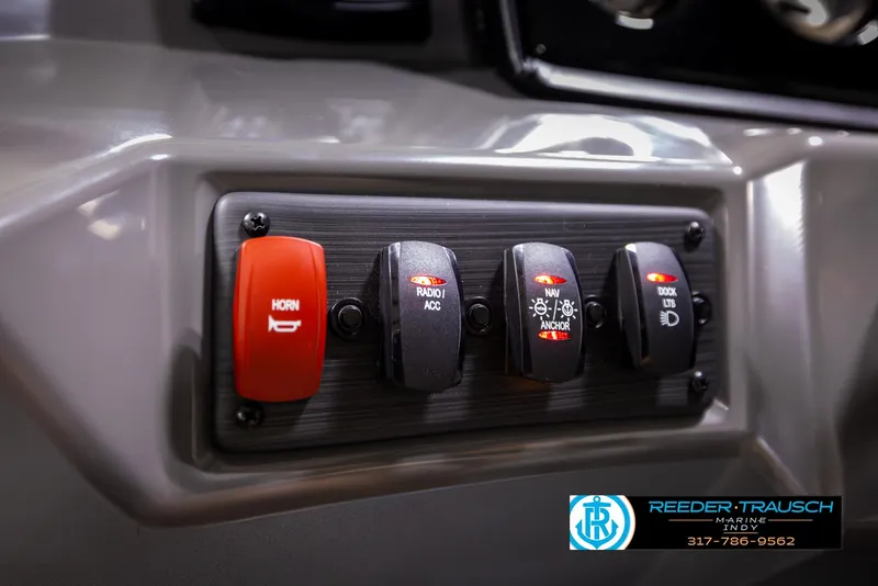 Slide: The Image of 2025 Bennington 21 SL boat control panel with switches and horn button. - 30