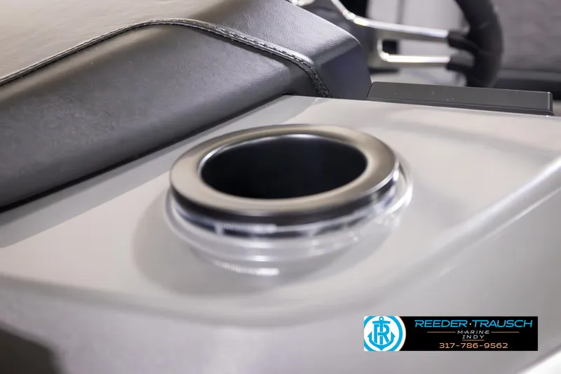 Slide: The Image of 2025 Bennington 21 SL boat cup holder detail with Reeder-Trausch Marine logo. - 36