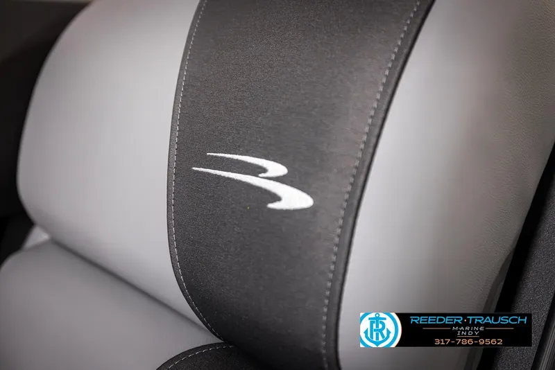 Slide: The Image of 2025 Bennington 21 SL boat seat with logo, featuring sleek black and gray design. - 40
