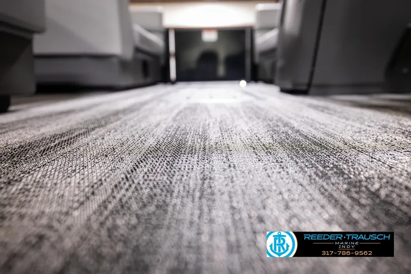 Slide: The Image of Close-up of carpet flooring in a 2025 Bennington 21 SL boat interior. - 41