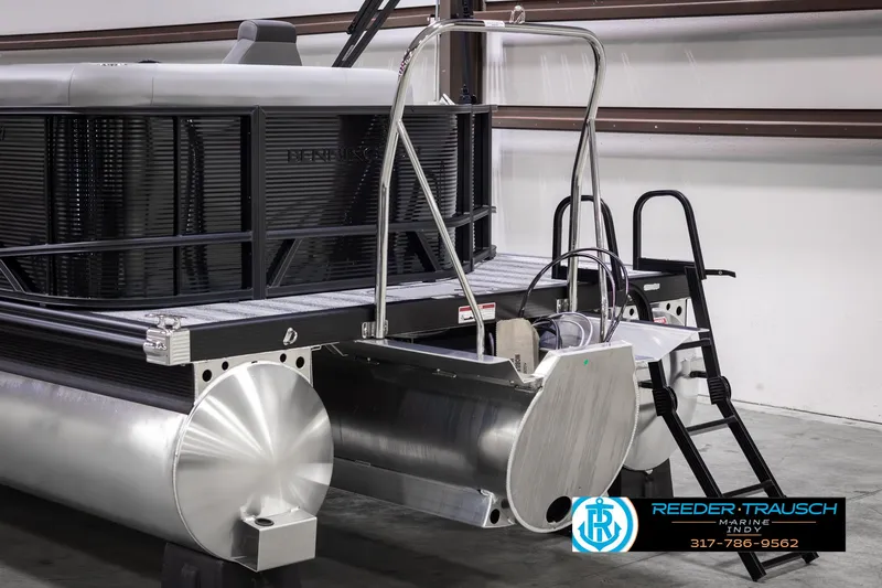 Slide: The Image of 2025 Bennington 21 SL pontoon boat rear view in showroom. - 42