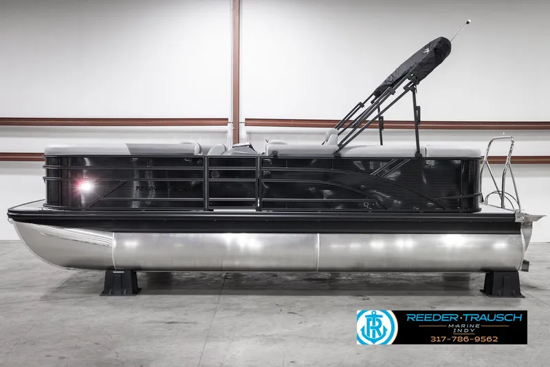 Slide: The Image of 2025 Bennington 21 SL pontoon boat in showroom, side view. - 6