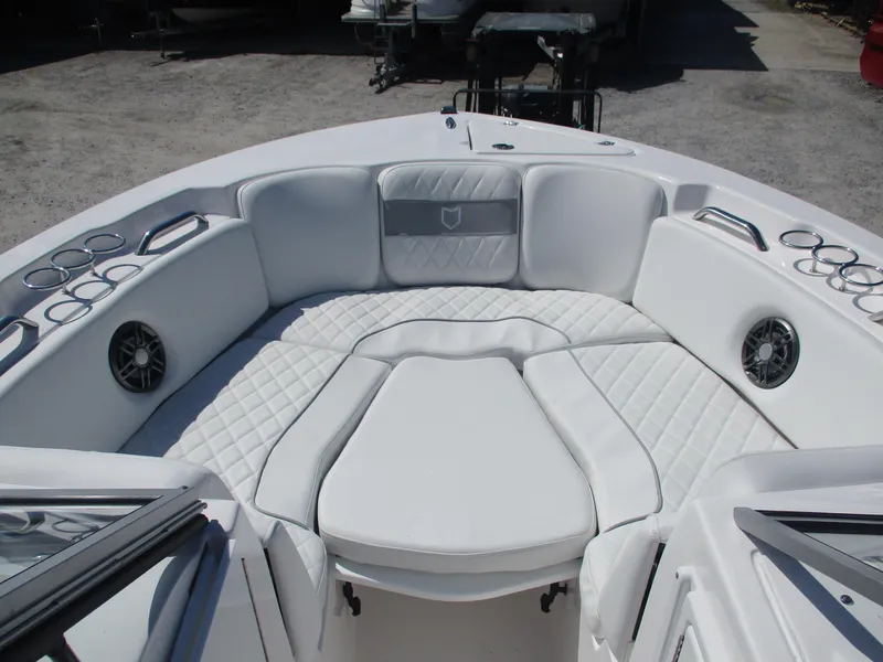 Slide: The Image of 2025 Sea Fox 228 Traveler boat interior with white cushioned seating and cup holders. - 10