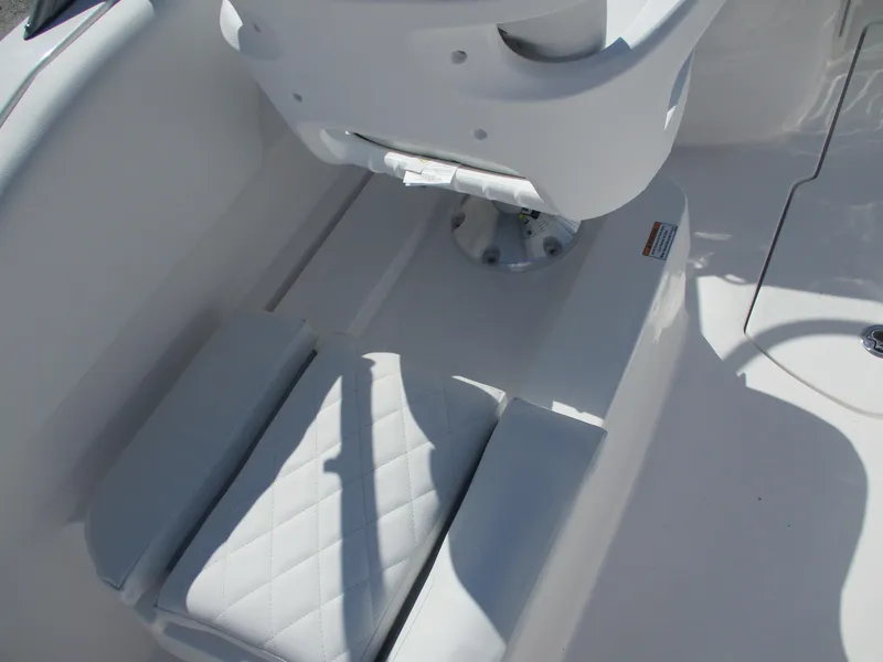 Slide: The Image of 2025 Sea Fox 228 Traveler boat seat with white cushioned upholstery. - 12