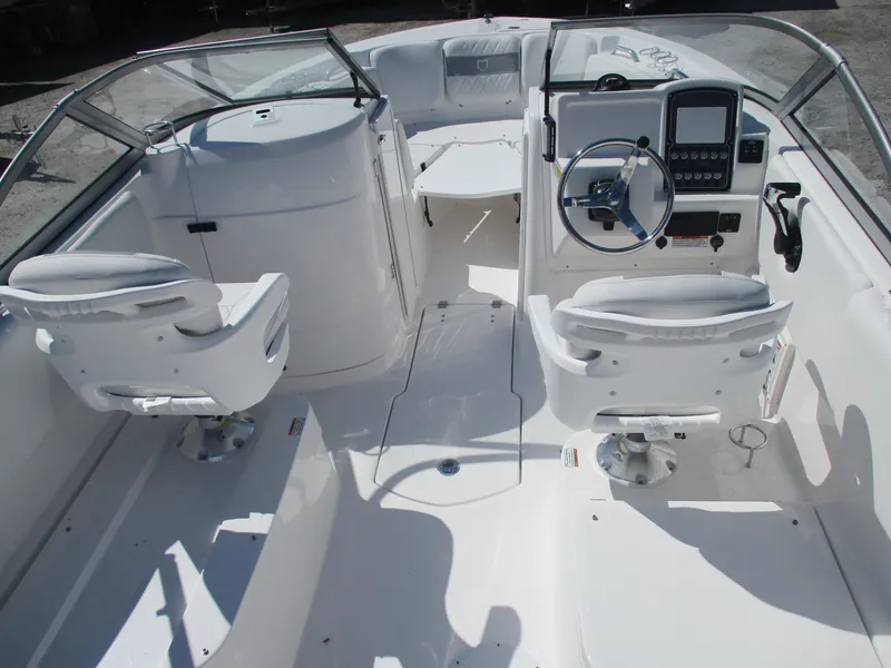 Slide: The Image of 2025 Sea Fox 228 Traveler boat interior with dual seats and modern dashboard. - 5
