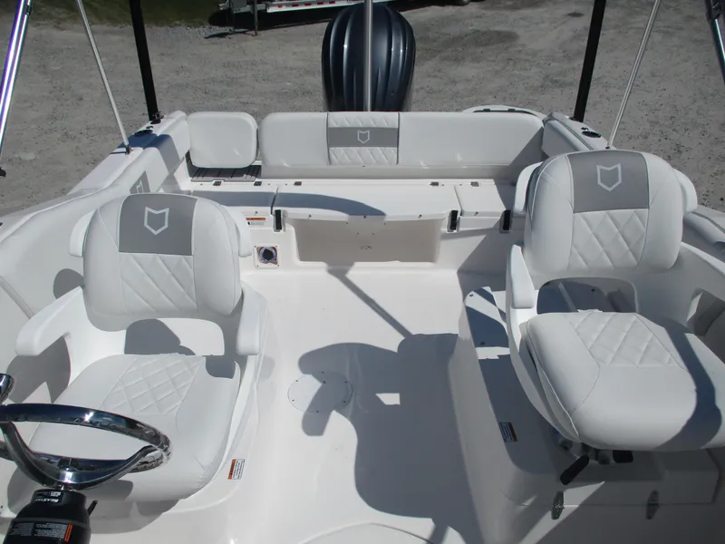 Slide: The Image of 2025 Sea Fox 228 Traveler boat interior with white seating and steering wheel. - 8