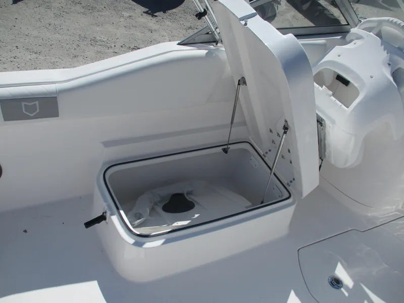 Slide: The Image of 2025 Sea Fox 228 Traveler boat storage compartment open, showcasing interior space. - 9
