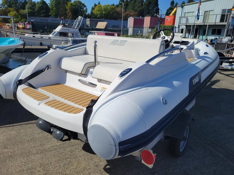 Slide: The Image of 2021 AB Inflatables ABJET 430XP boat on display, featuring sleek design and modern seating. - 10