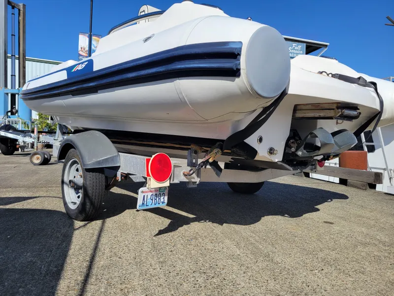 Slide: The Image of 2021 AB Inflatables ABJET 430XP on trailer, rear view, sunny day. - 18