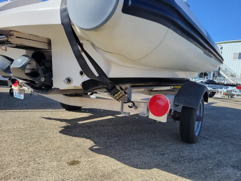 Slide: The Image of 2021 AB Inflatables ABJET 430XP on trailer, rear view, showing hull and trailer details. - 19