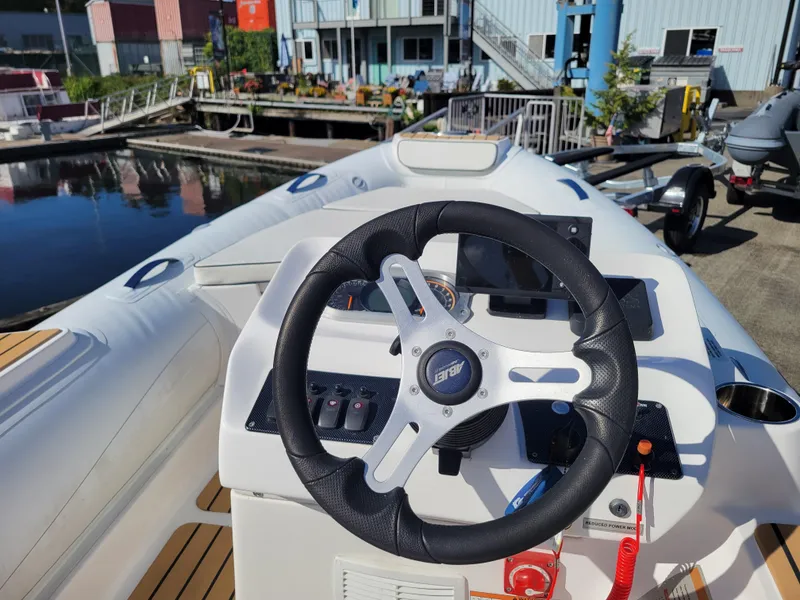 Slide: The Image of 2021 AB Inflatables ABJET 430XP boat steering console at marina. - 20