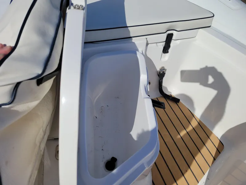 Slide: The Image of 2021 AB Inflatables ABJET 430XP interior storage compartment with cushioned seating and wooden flooring. - 27