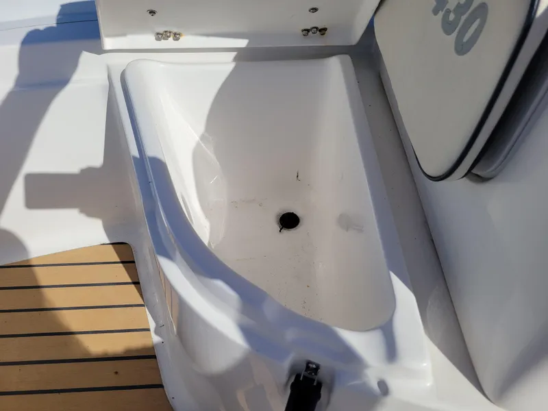 Slide: The Image of 2021 AB Inflatables ABJET 430XP boat storage compartment with drain, featuring teak-style flooring. - 28