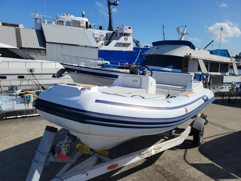 The Image of 2021 AB Inflatables ABJET 430XP boat on trailer at marina. - 6
