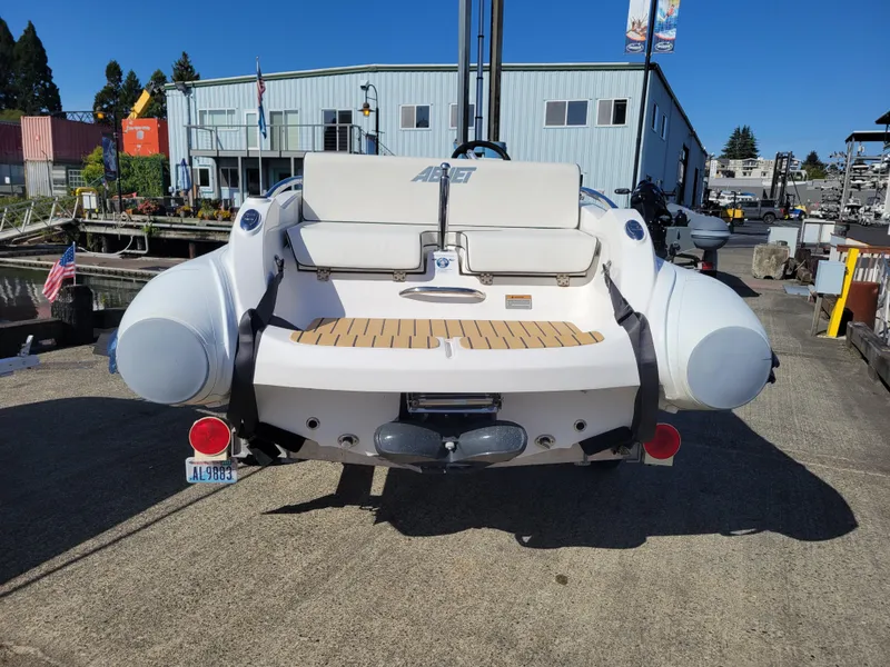 Slide: The Image of 2021 AB Inflatables ABJET 430XP boat at a marina, rear view. - 9
