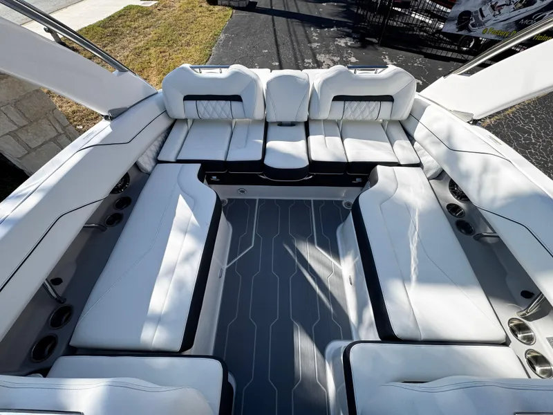 Slide: The Image of 2025 Regal LS4 boat interior with white seating and modern design. - 11