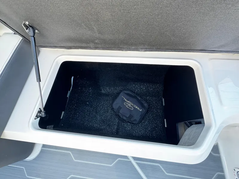 Slide: The Image of 2025 Regal LS4 storage compartment with open lid and visible interior. - 13