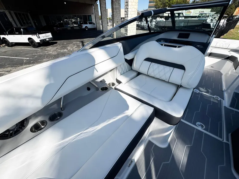 Slide: The Image of 2025 Regal LS4 boat interior with white leather seating and modern design. - 18