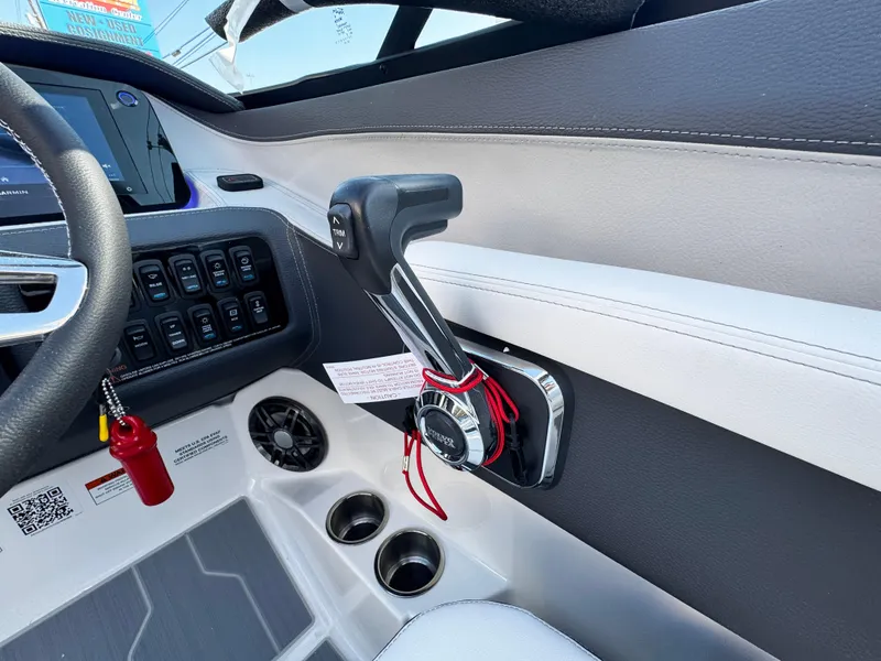 Slide: The Image of 2025 Regal LS4 boat interior with control panel and throttle lever. - 22