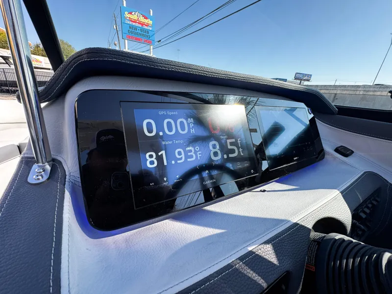Slide: The Image of 2025 Regal LS4 boat dashboard with digital display showing speed and temperature. - 24