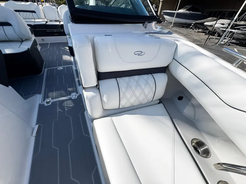 Slide: The Image of 2025 Regal LS4 boat interior with white leather seating and modern design. - 32