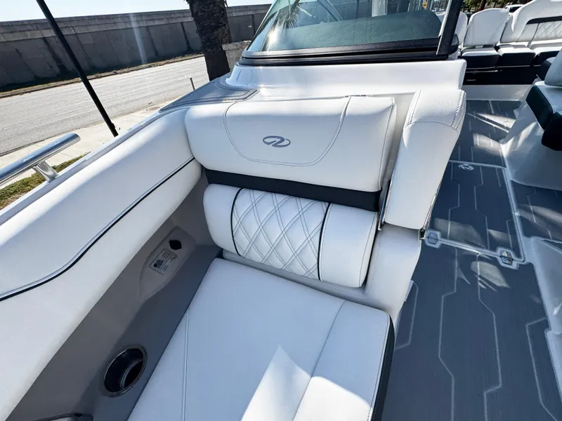 Slide: The Image of 2025 Regal LS4 boat interior with white leather seating and modern design. - 34