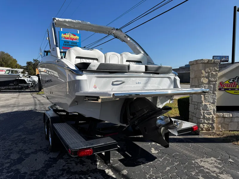 Slide: The Image of 2025 Regal LS4 boat on trailer, rear view, sunny day. - 4