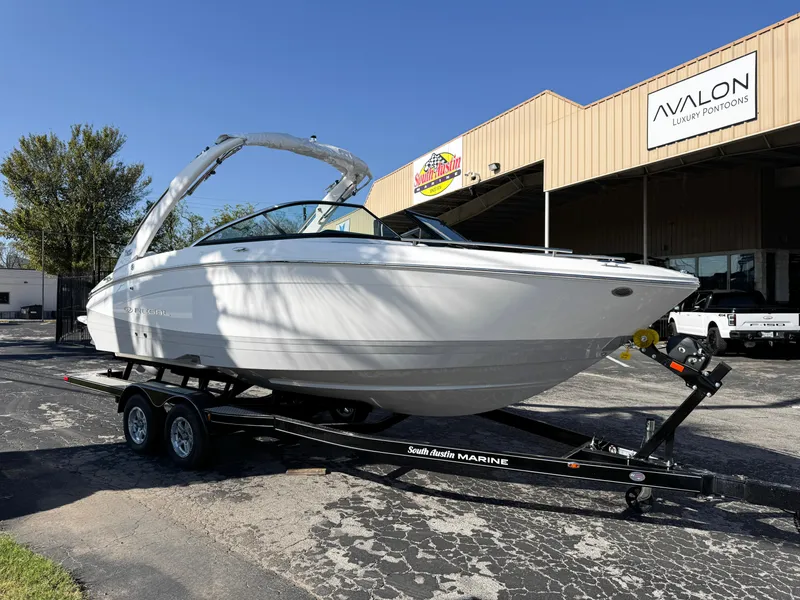 Slide: The Image of 2025 Regal LS4 boat on trailer outside Avalon Luxury Pontoons building. - 40