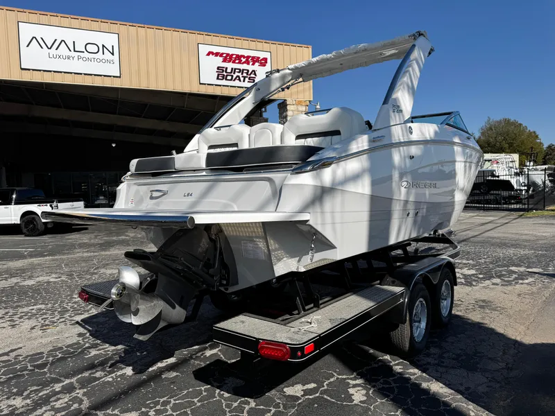 Slide: The Image of 2025 Regal LS4 boat on trailer at dealership, rear view. - 6