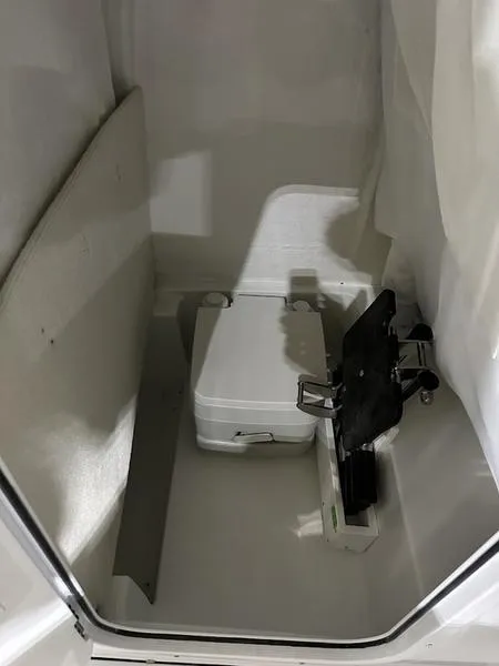 Slide: The Image of 2025 Sea Hunt Ultra 239se boat interior storage compartment. - 15