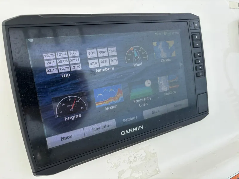 Slide: The Image of Garmin marine display on 2022 Cobia 237 Center Console showing navigation and engine data. - 42