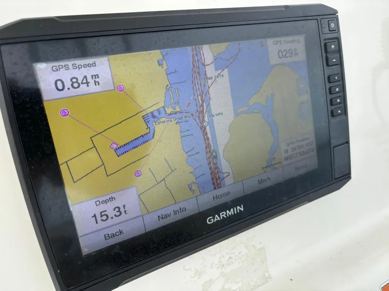 Slide: The Image of Garmin GPS display on 2022 Cobia 237 Center Console boat, showing navigation data. - 43