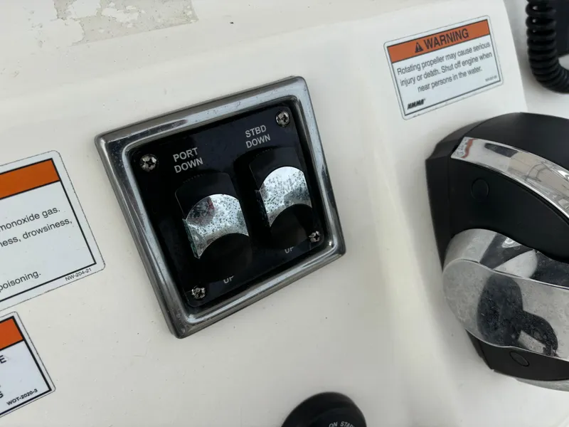 Slide: The Image of Control panel of 2022 Cobia 237 Center Console boat with warning labels. - 44