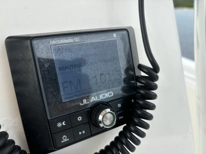 Slide: The Image of JL Audio MediaMaster 50 radio on 2022 Cobia 237 Center Console boat. - 46