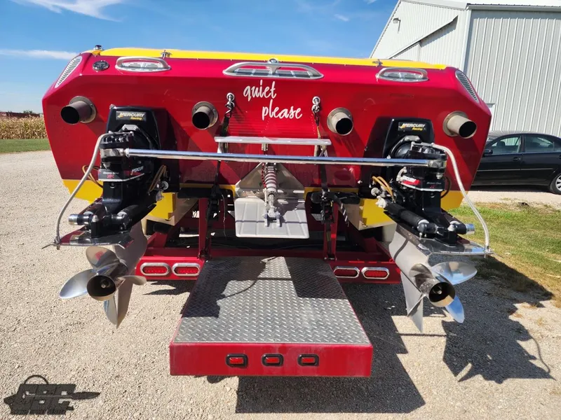 Slide: The Image of 2005 Eliminator Daytona 30 boat rear view with dual engines and propellers. - 36