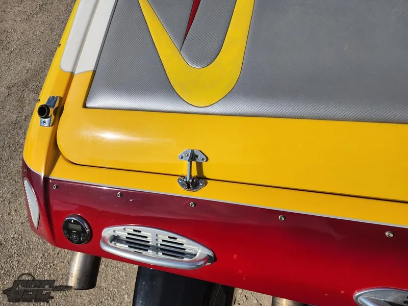 Slide: The Image of Close-up of 2005 Eliminator Daytona 30 boat with vibrant yellow and red design. - 45