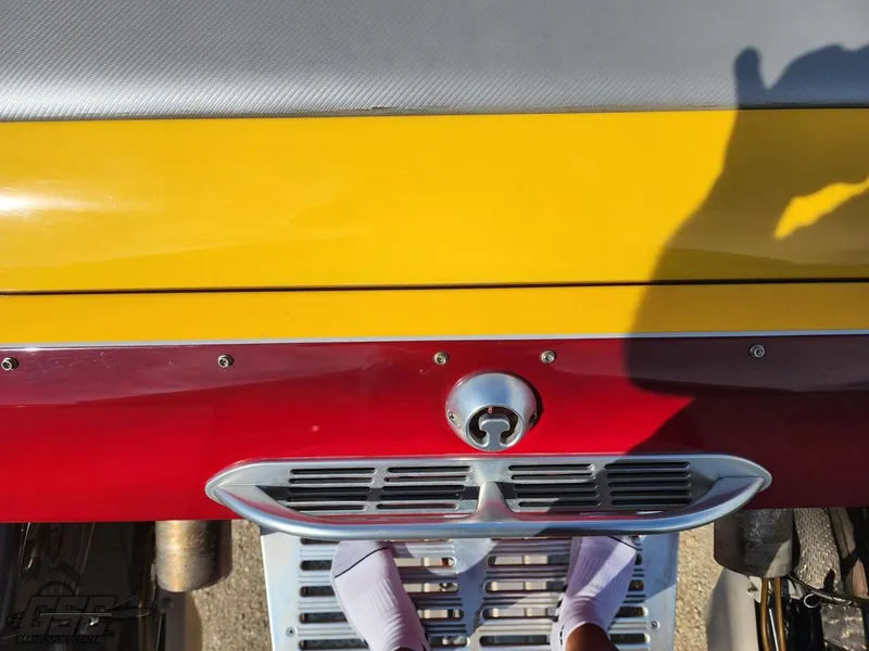 Slide: The Image of Eliminator Daytona 30 boat, 2005 model, vibrant yellow and red design, rear view. - 46