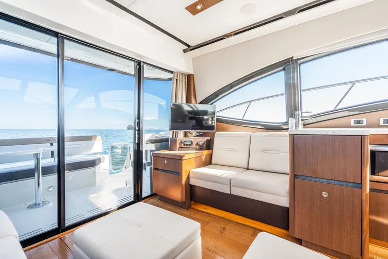 Slide: The Image of Luxurious interior of 2016 Sea Ray 400 Sundancer yacht with ocean view. - 15