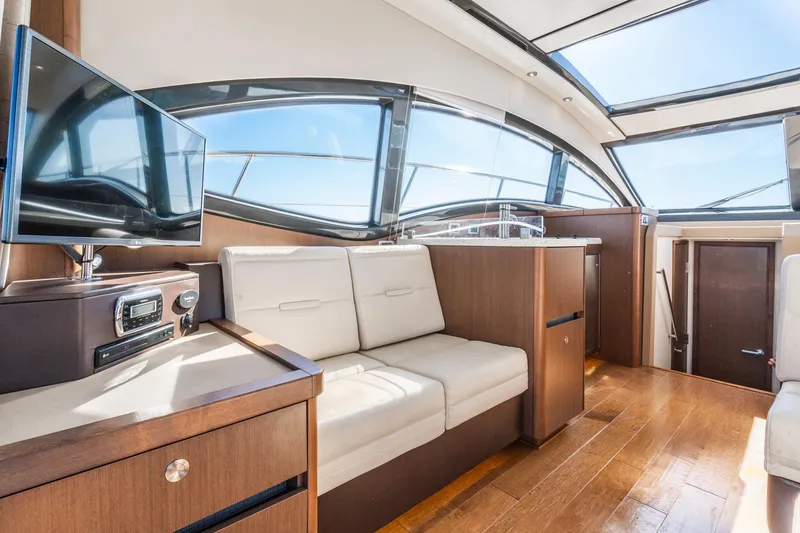 Slide: The Image of Luxurious interior of 2016 Sea Ray 400 Sundancer yacht with modern amenities and sleek design. - 16