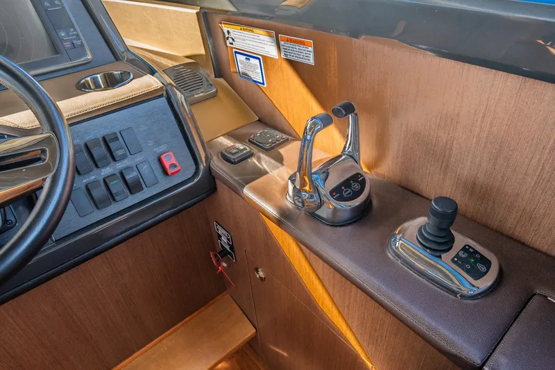 Slide: The Image of Control panel of 2016 Sea Ray 400 Sundancer yacht with throttle and joystick. - 22