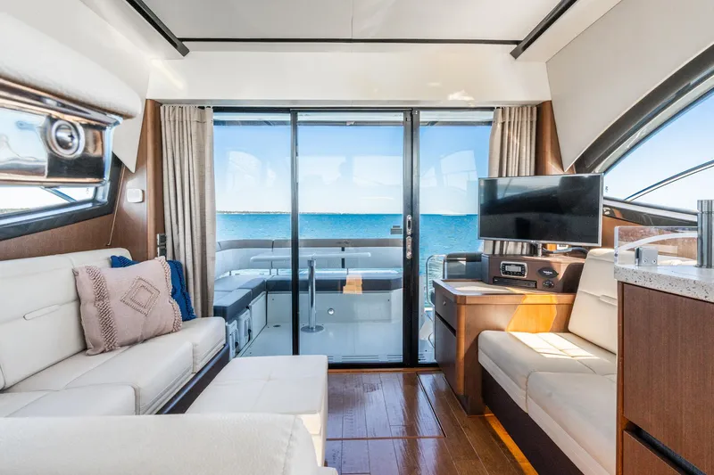 Slide: The Image of Luxurious interior of 2016 Sea Ray 400 Sundancer yacht with ocean view. - 23