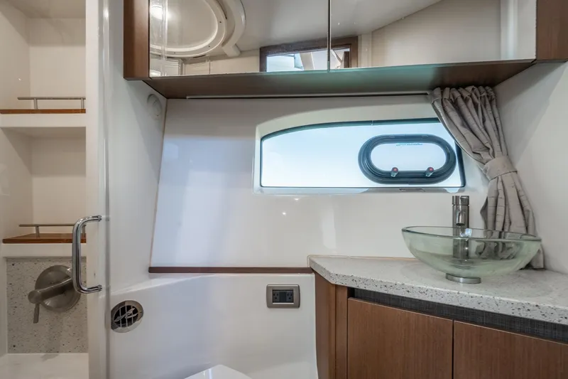 Slide: The Image of Luxurious bathroom interior of 2016 Sea Ray 400 Sundancer yacht with modern fixtures. - 26