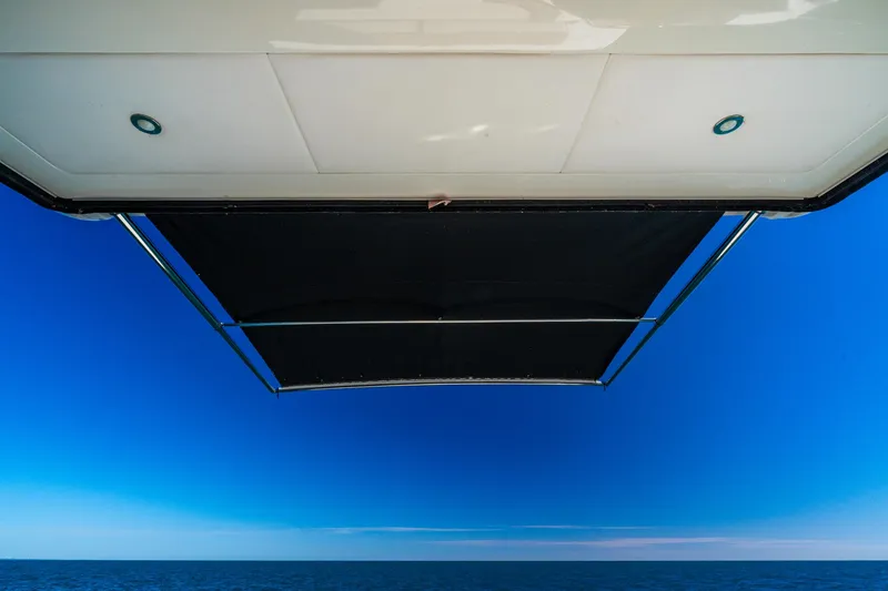 Slide: The Image of Sea Ray 400 Sundancer 2016 boat canopy against clear blue sky. - 31