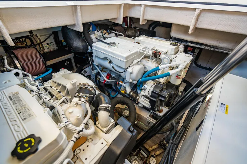 Slide: The Image of Engine room of 2016 Sea Ray 400 Sundancer yacht, showcasing mechanical components. - 32