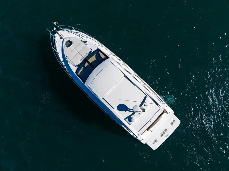Slide: The Image of Aerial view of 2016 Sea Ray 400 Sundancer yacht on open water. - 6