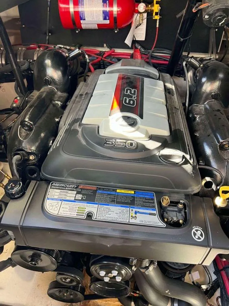 Slide: The Image of 2017 Sea Ray SLX 280 engine, Mercury 6.2L 350 HP, with fire extinguisher. - 14