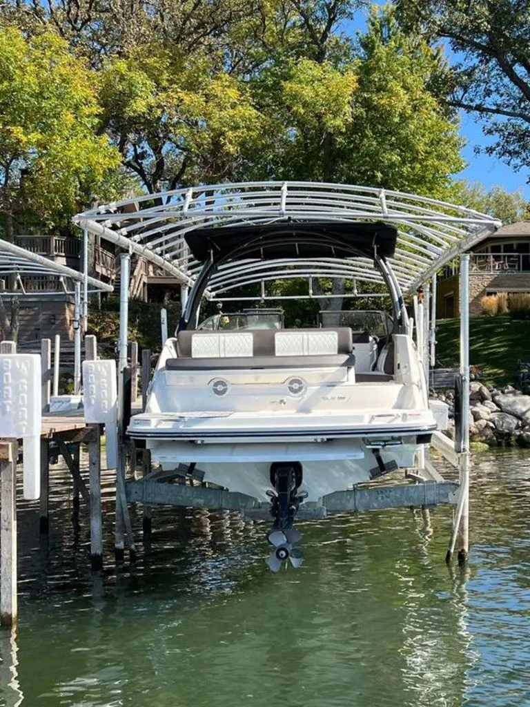 Slide: The Image of 2017 Sea Ray SLX 280 boat docked under canopy on a sunny day. - 3